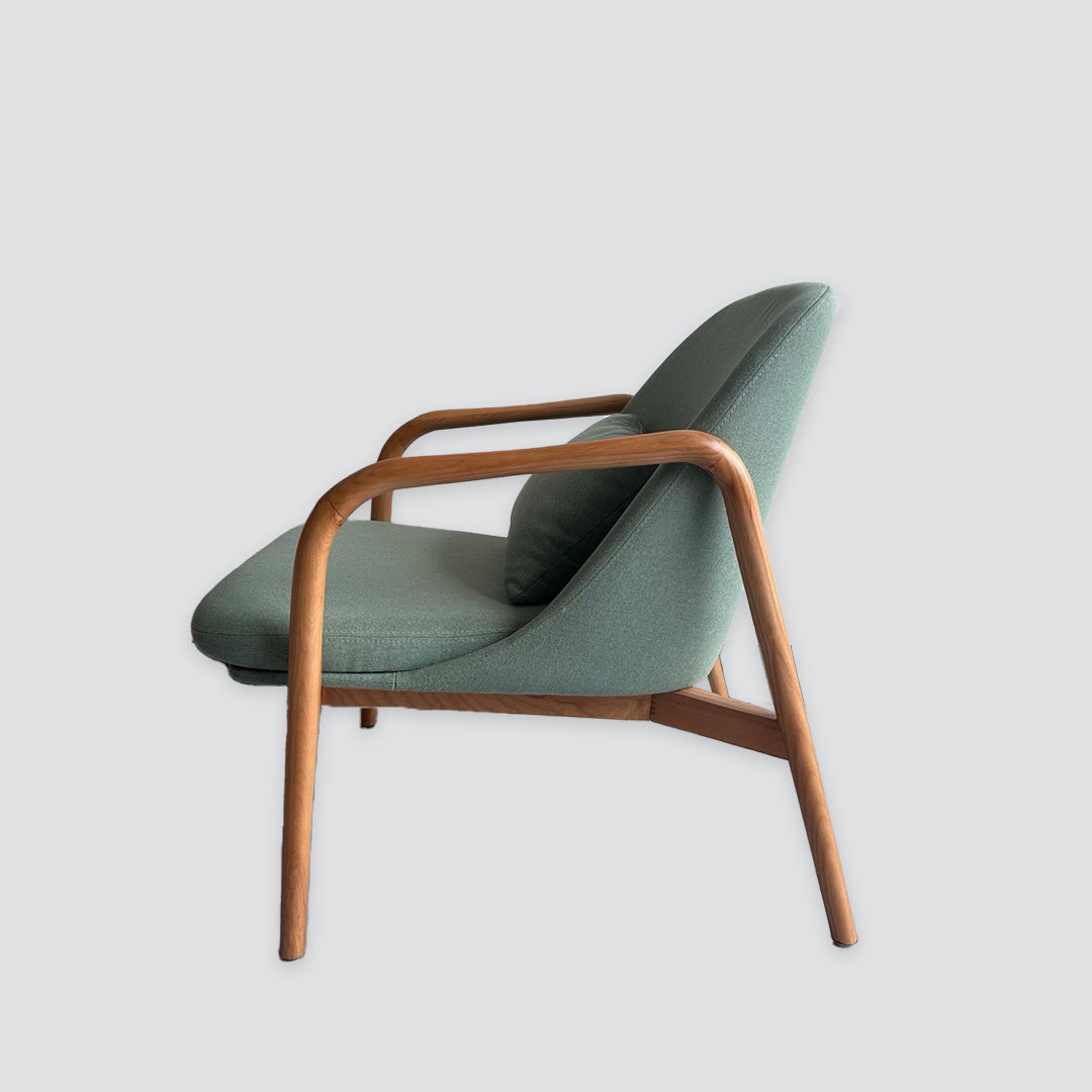 Wooden armchair in light green fabric