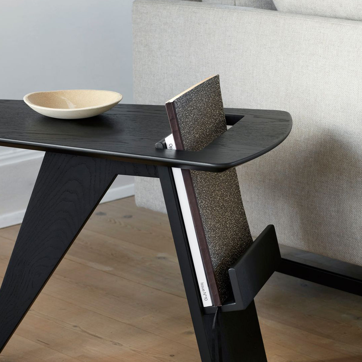 Black side table with magazine rack