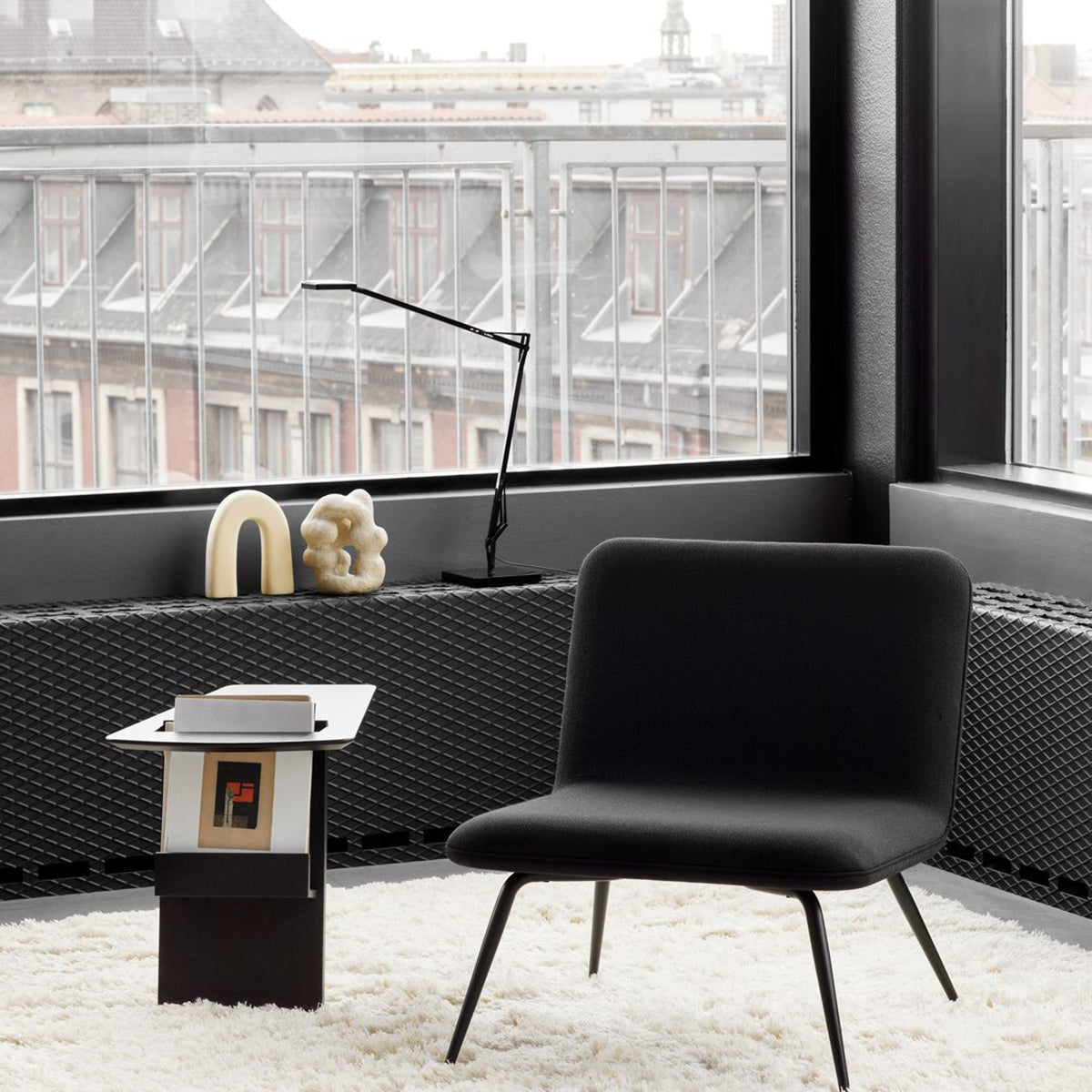 Black side table with magazine rack
